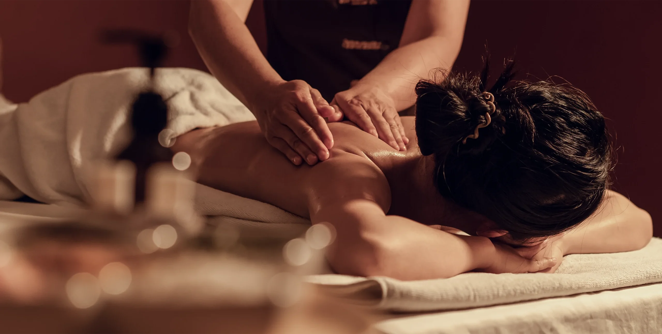 Relaxing full-body massage treatment in a warm, calming wellness setting